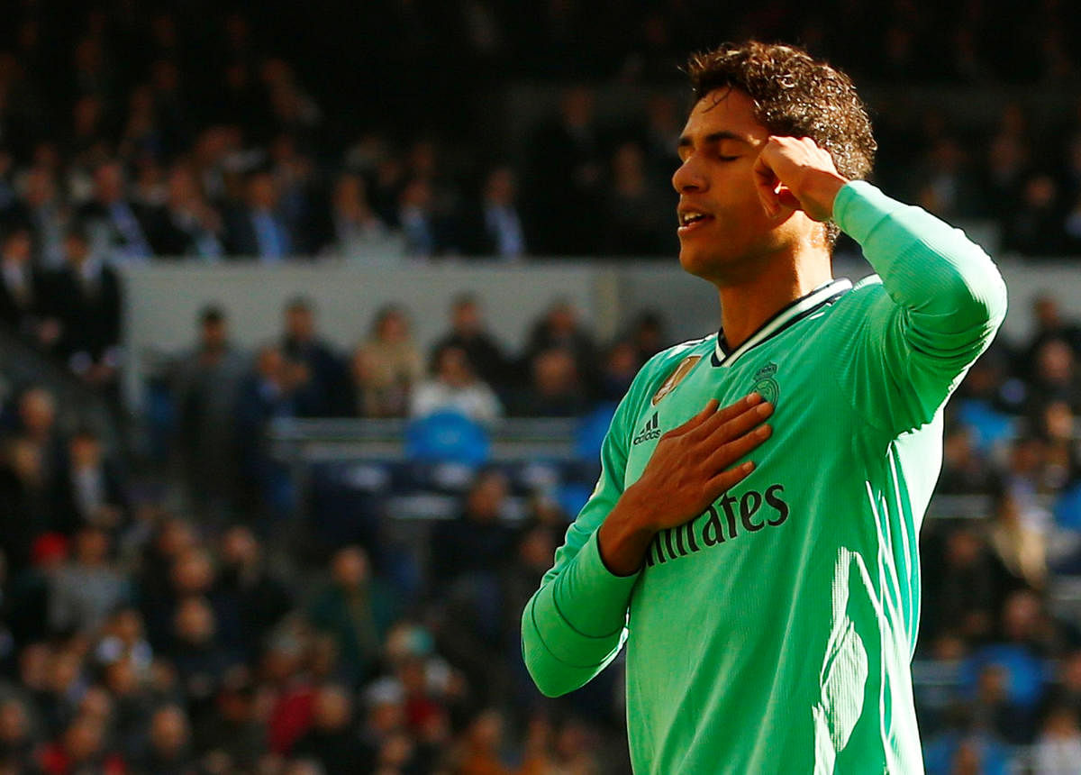 Real Madrid's Raphael Varane celebrates scoring their first goal. (Reuters Photo)