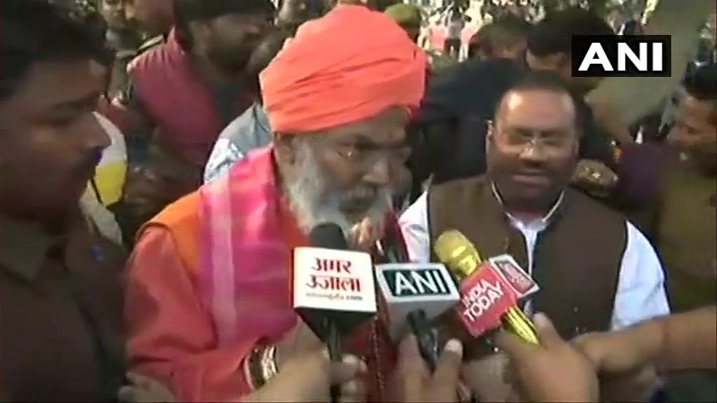 A large number of people, who included local residents and workers of the opposition parties, shouted slogans against the two UP ministers and the saffron-clad Sakshi Maharaj, when they alighted from their vehicles and proceeded toward the house of the deceased. Photo/ANI