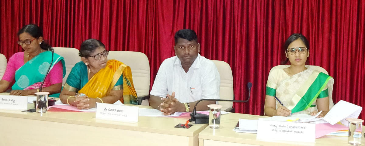 Zilla Panchayat President Dinaker Babu speaks to officials at the monthly KDP meeting held at ZP Hall in Udupi on Friday.