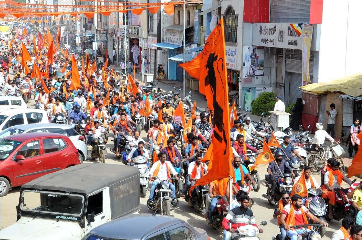 Members of VHP and Bajrang Dal took out a bike rally in M G Road in Chikkamagaluru.