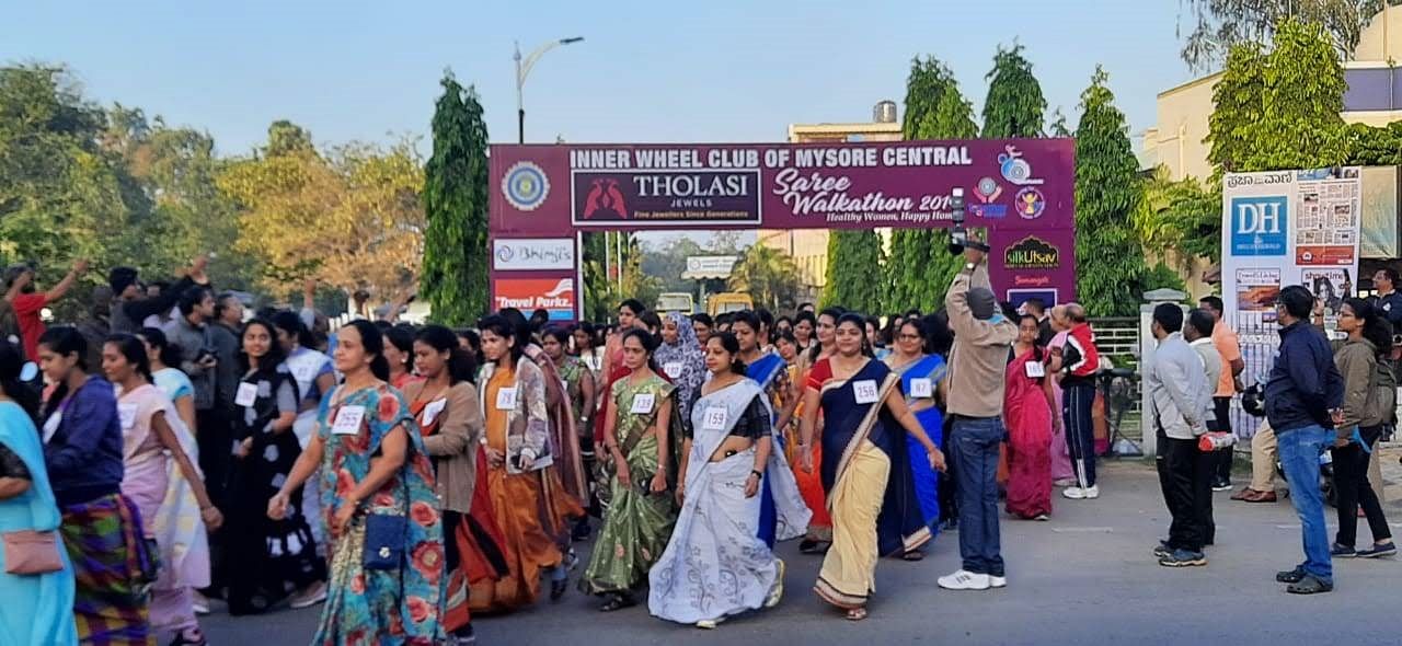 Women participate in Saree Walkathon, organised by Inner Wheel Club of Mysore Central, on Scouts and Guides Grounds, in Mysuru, on Sunday. (DH Photo)