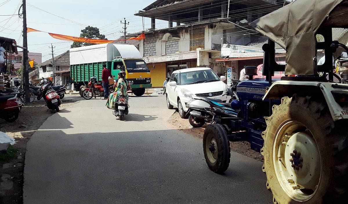 Haphazard parking of vehicles affects smooth vehicular movement on Subhash Road in Koppa.