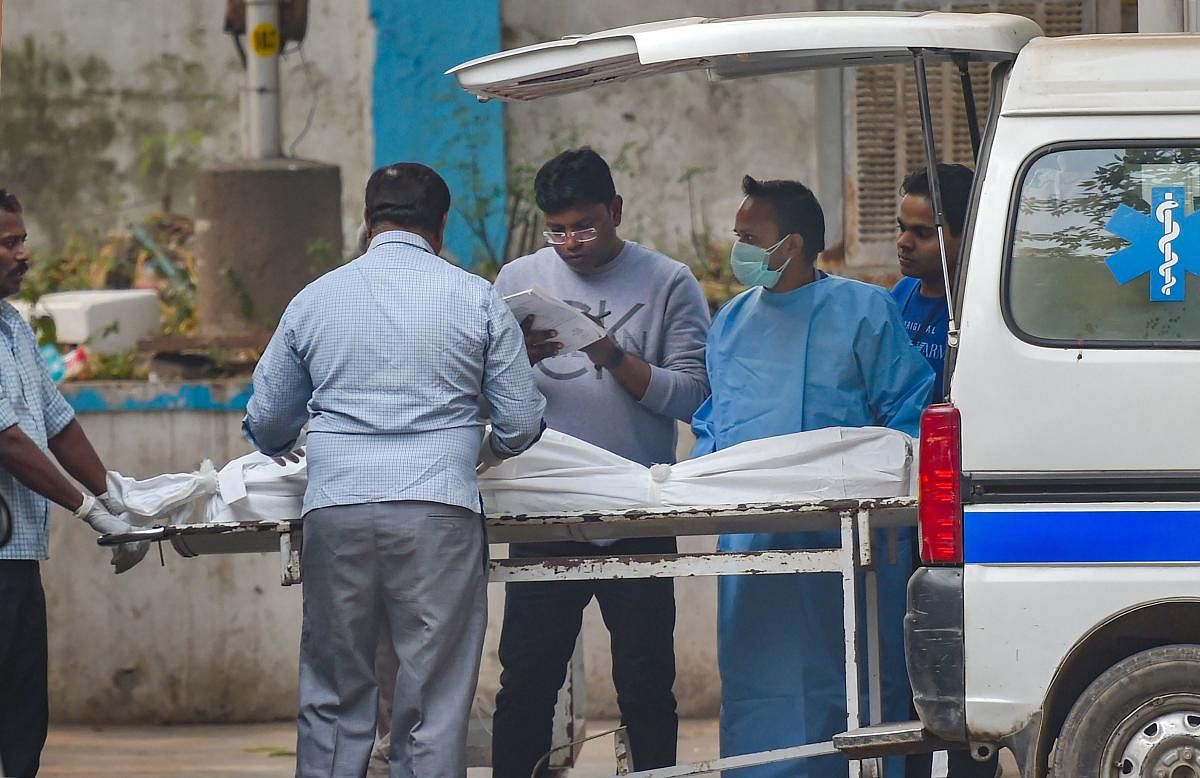 Mortal remains of a victim who died due to a fire at a factory in Rani Jhansi Road being brought to a mortuary, at Lok Nayak Hospital, in New Delhi, Sunday, Dec. 8, 2019. At least 43 labourers were killed and several others injured in the mishap. (PTI Photo)