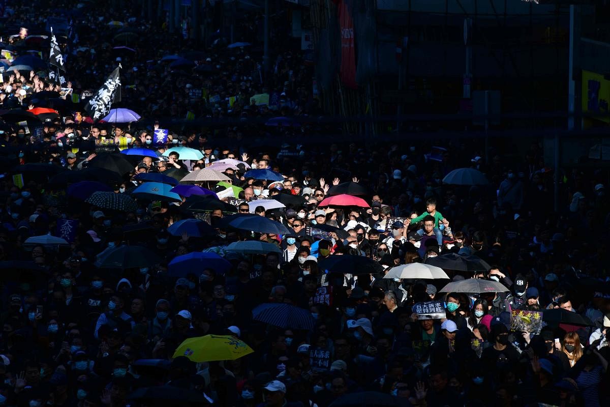 The rally, which received rare police permission, comes two weeks after pro-establishment parties got a drubbing in local elections, shattering government claims that a "silent majority" opposed the protests. (Photo by AFP)