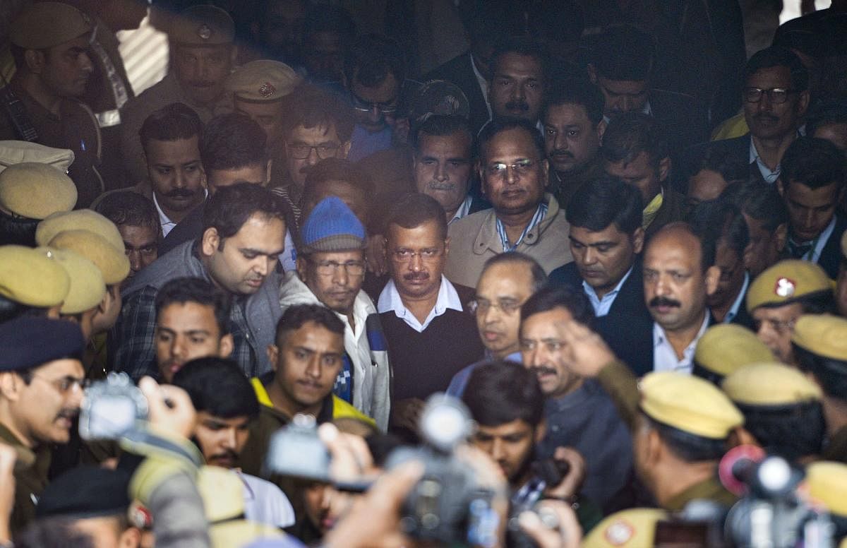 Delhi Chief Minister Arvind Kejriwal and State Health Minister Satyendra Jain leave after visiting the site of a factory at Rani Jhansi Road where a major fire broke out. PTI