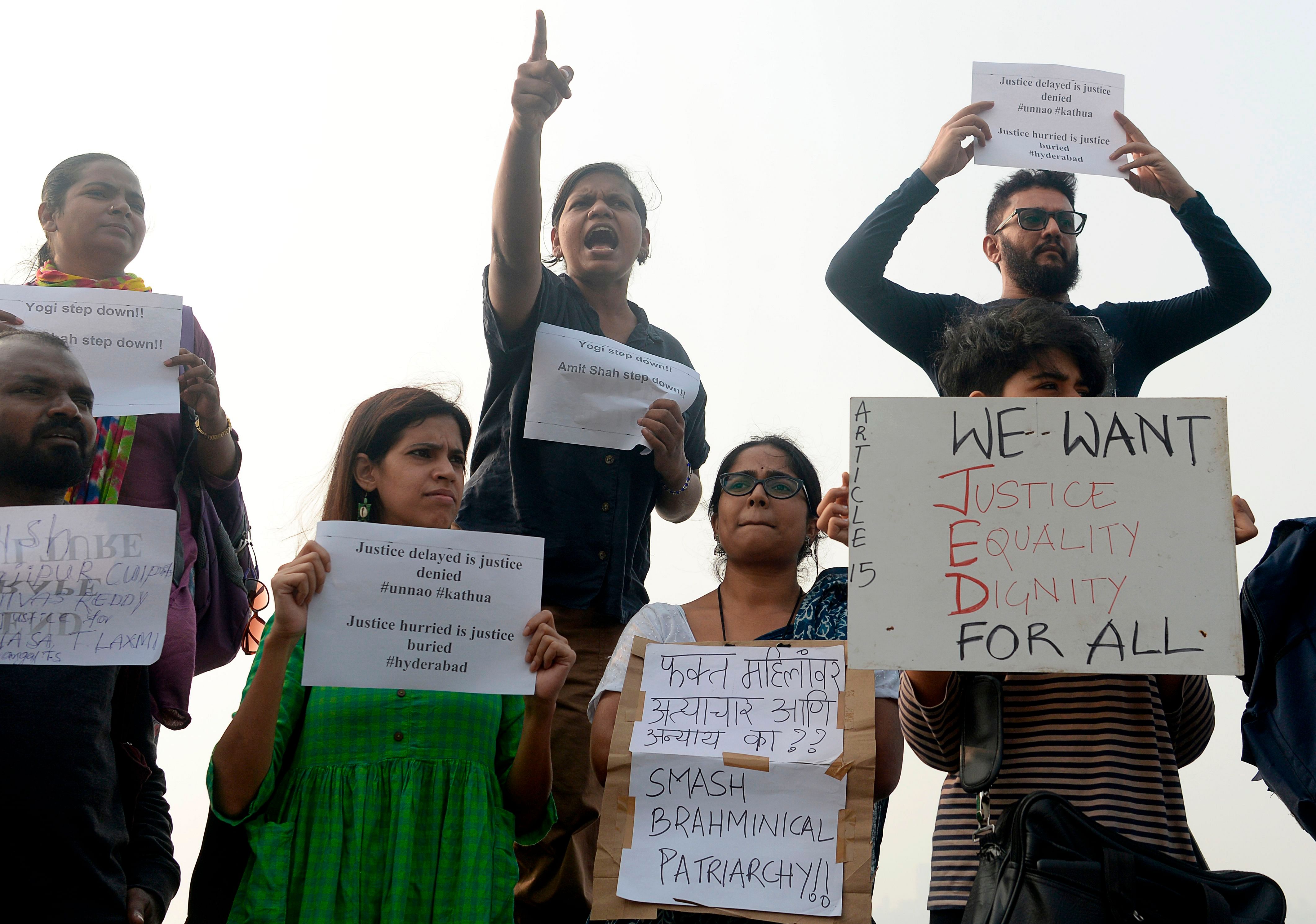 Activists and supporters hold placards and shout slogans to protest against the alleged rape and murder of a 27-year-old veterinary doctor in Hyderabad and other recent sexual assaults, in Mumbai. (AFP Photo)