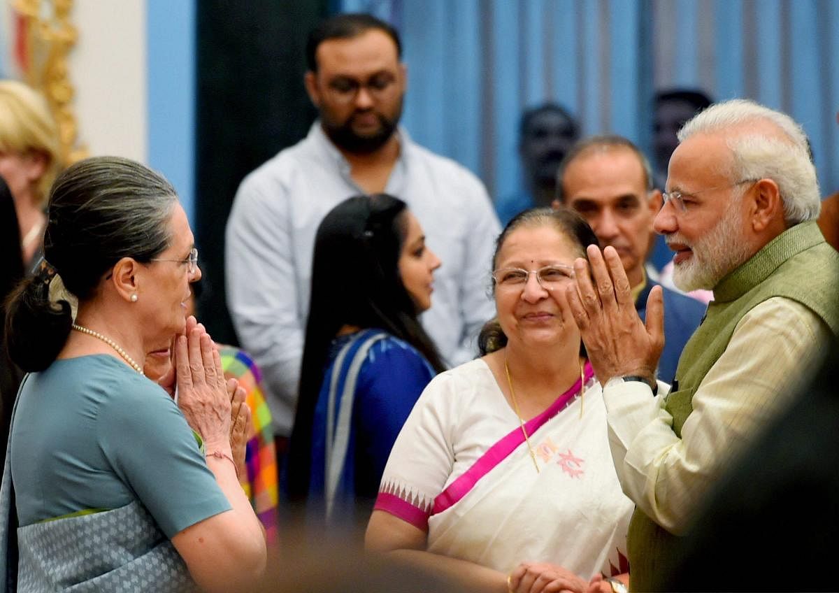 Prime Minister Narendra Modi and Congress President Sonia Gandhi. (PTI photo)