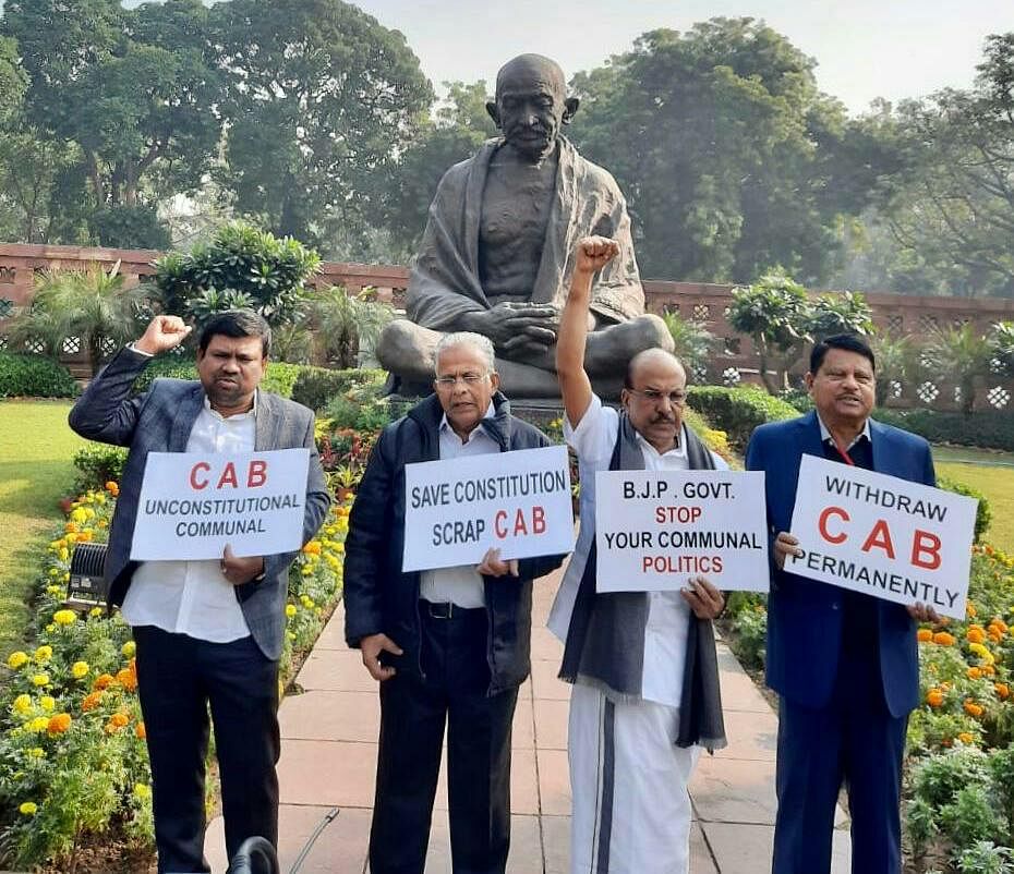 Indian Union Muslim League party MPs hold a protest in front of Mahatma Gandhi statue in Parliament premises against the Citizenship (Amendment) Bill. Photo/Twitter (@iumlofficial)