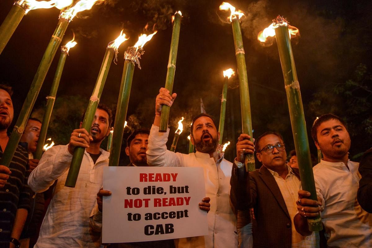 Citizens take part in a torch light procession to protest against the government's Citizenship Amendment Bill, in Guwahati on December 7, 2019. Photo/AFP