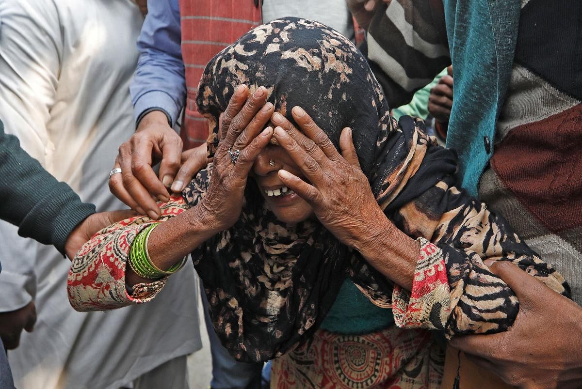 A woman cries as she waits outside a mortuary to receive the body of her relative who died in a fire (PTI Photo)
