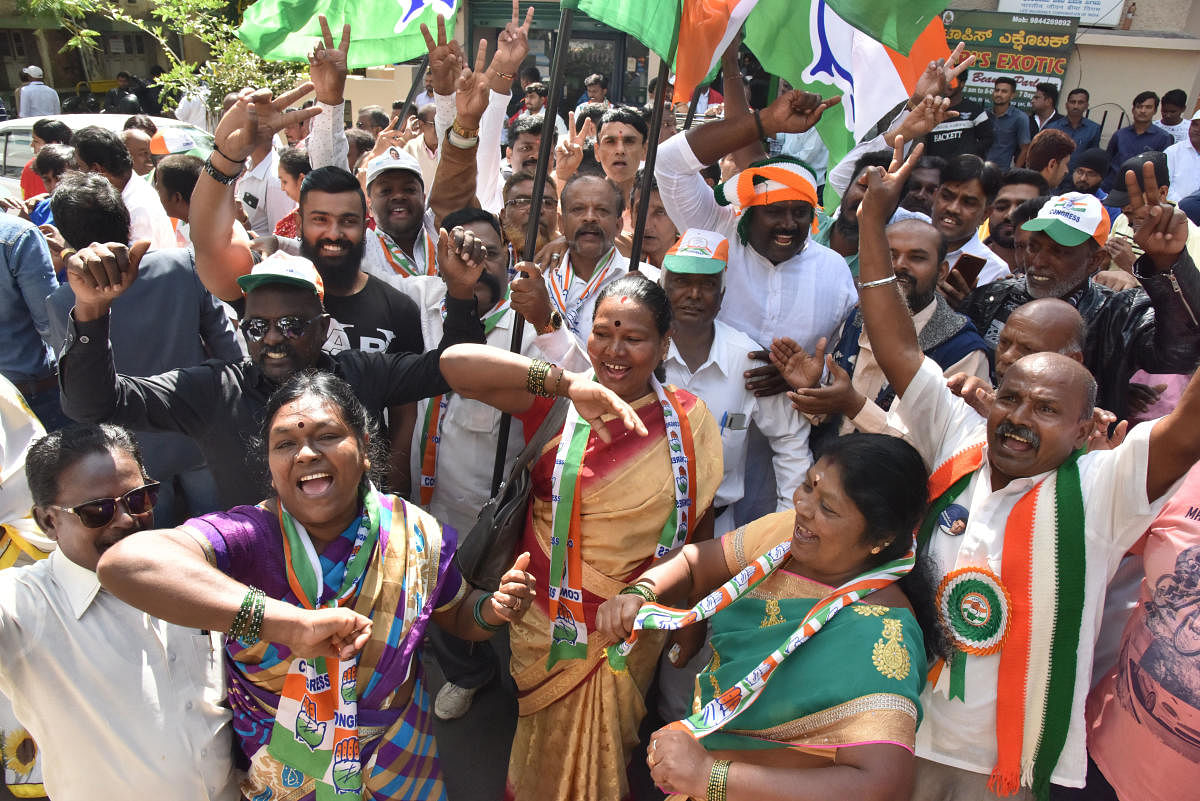 Congress supporters celebrate Rizwan Arshad's victory in front of Mount Carmel College on Monday. DH Photo/Janardhan B K