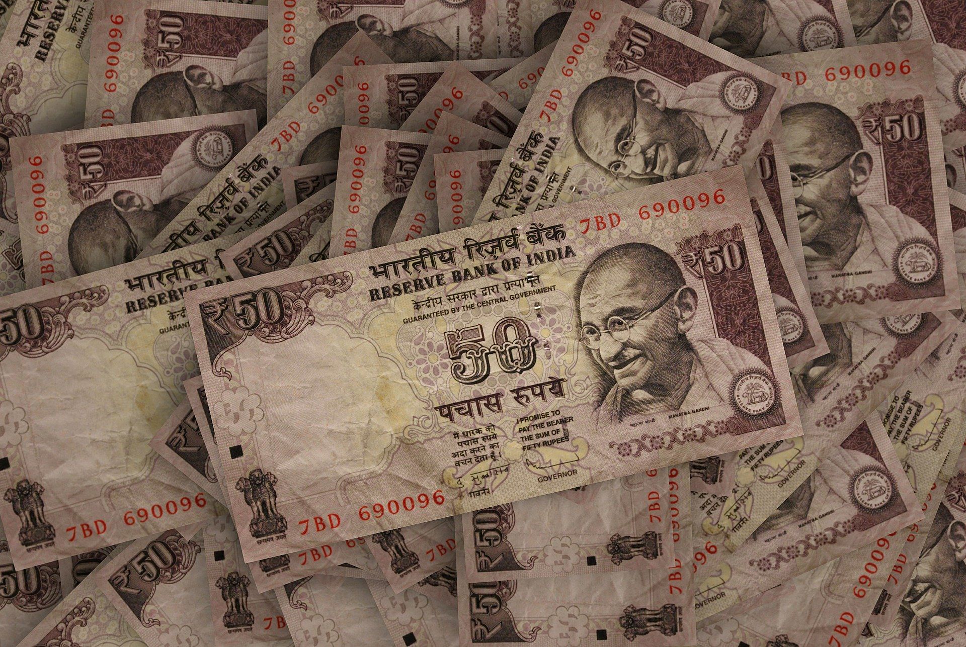 The rupee settled 12 paise higher at 70.92 against the US dollar on Tuesday amid softening crude oil prices and weakening of the greenback vis-a-vis major global currencies.