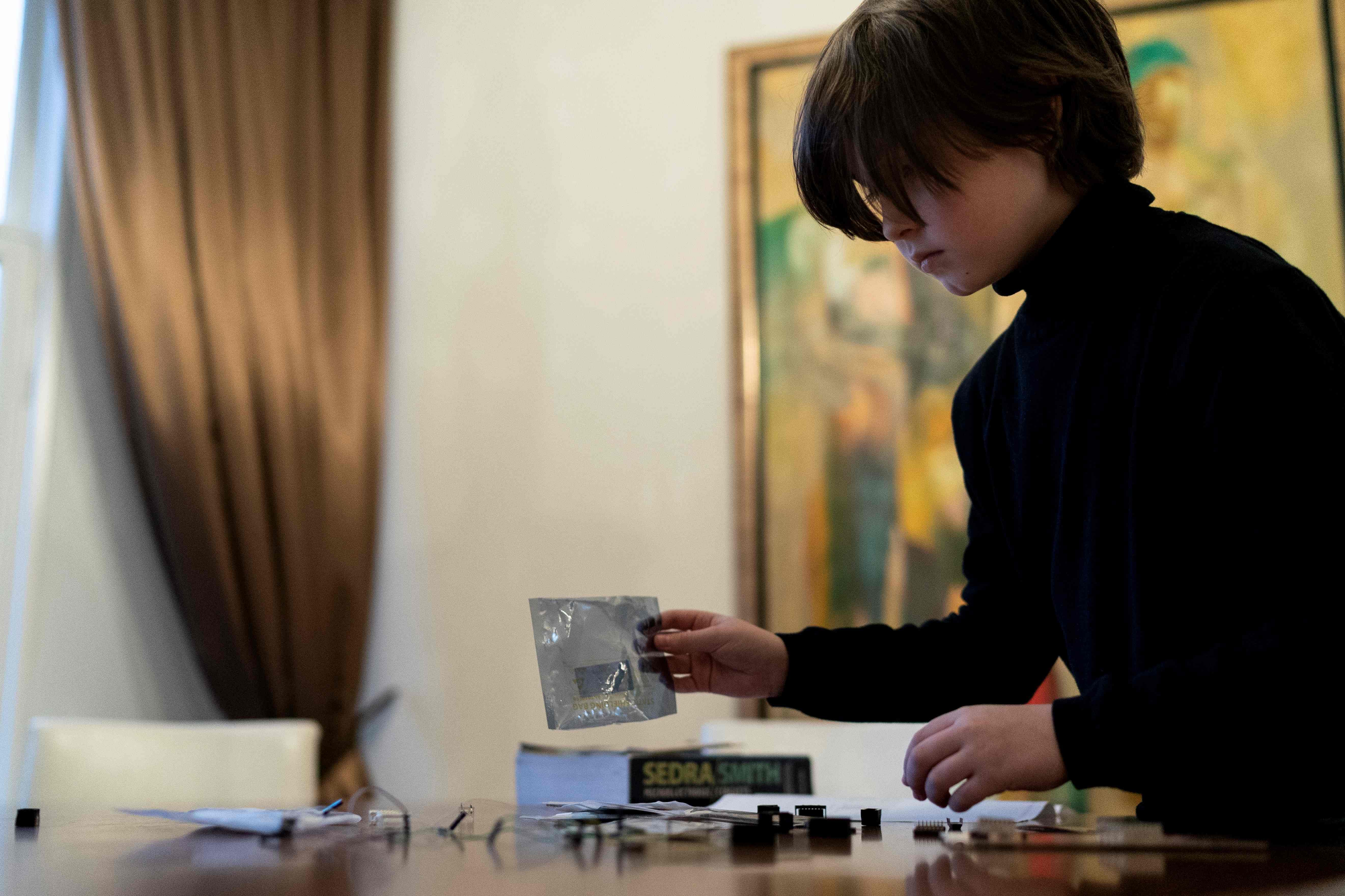 Belgian student Laurent Simons, 9 years old, poses during a photo session at his home. (AFP Photo)