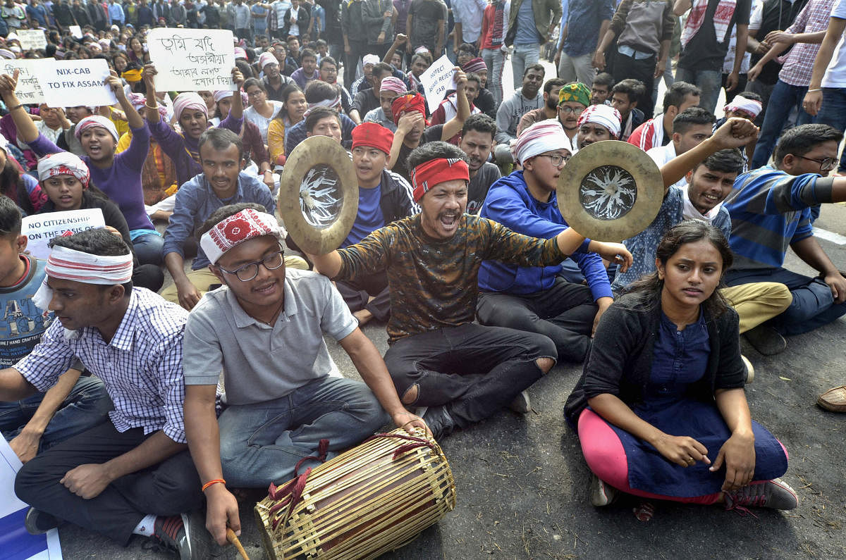 College students raise slogans in protest against the Citizenship Amendment Bill (CAB) during a strike, in Guwahati. (PTI photo)