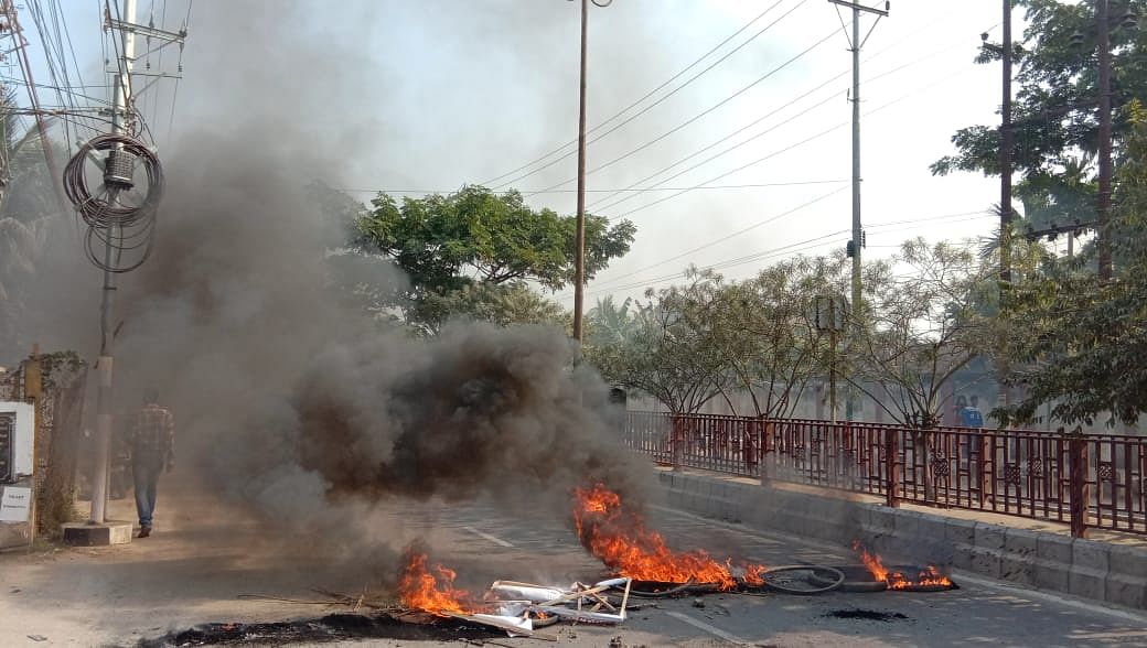 Protesters blocked many roads, burnt tyres, hanged and burnt effigies of senior BJP leaders and even cased convoys of ministers as most offices, schools and market places remained shut and normal life came to a standstill. (Photo: Gautam Dutta/Guwahati)