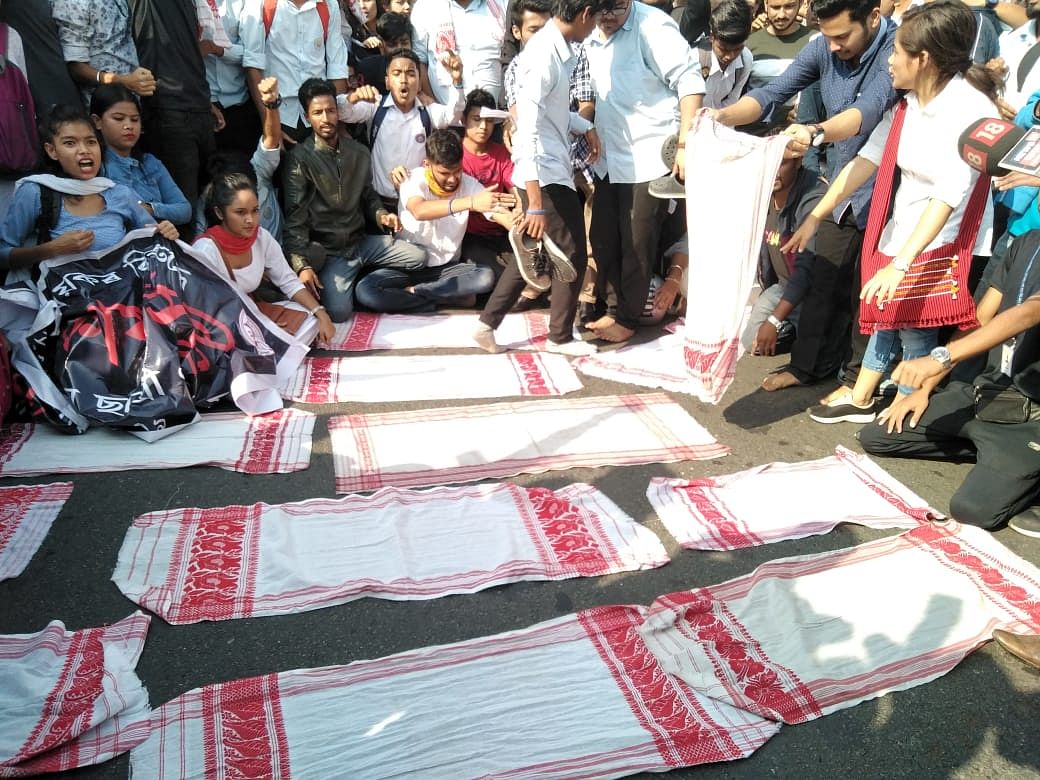 Students in Guwahati displaying traditional gamosa to stage a protest against CAB on Wednesday. (Photo credit: Abhijit Bose/Guwahati)