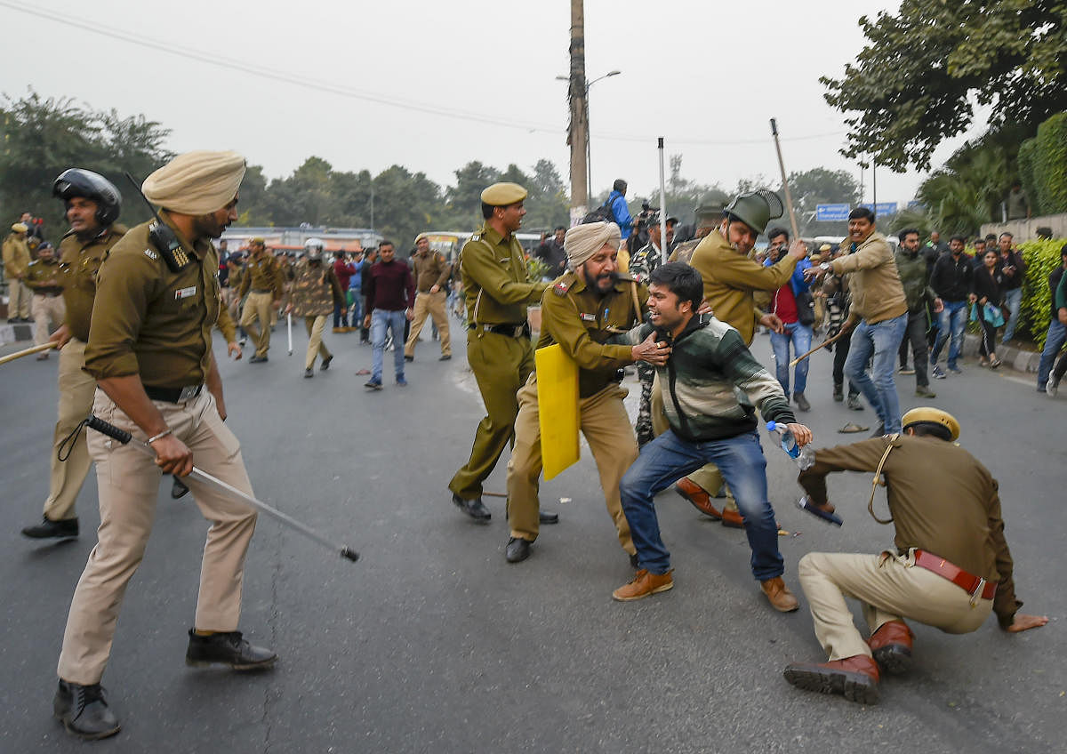  JNU students engaged in a scuffle with the police during their march from the University campus to Rashtrapati Bhavan. PTI Photo