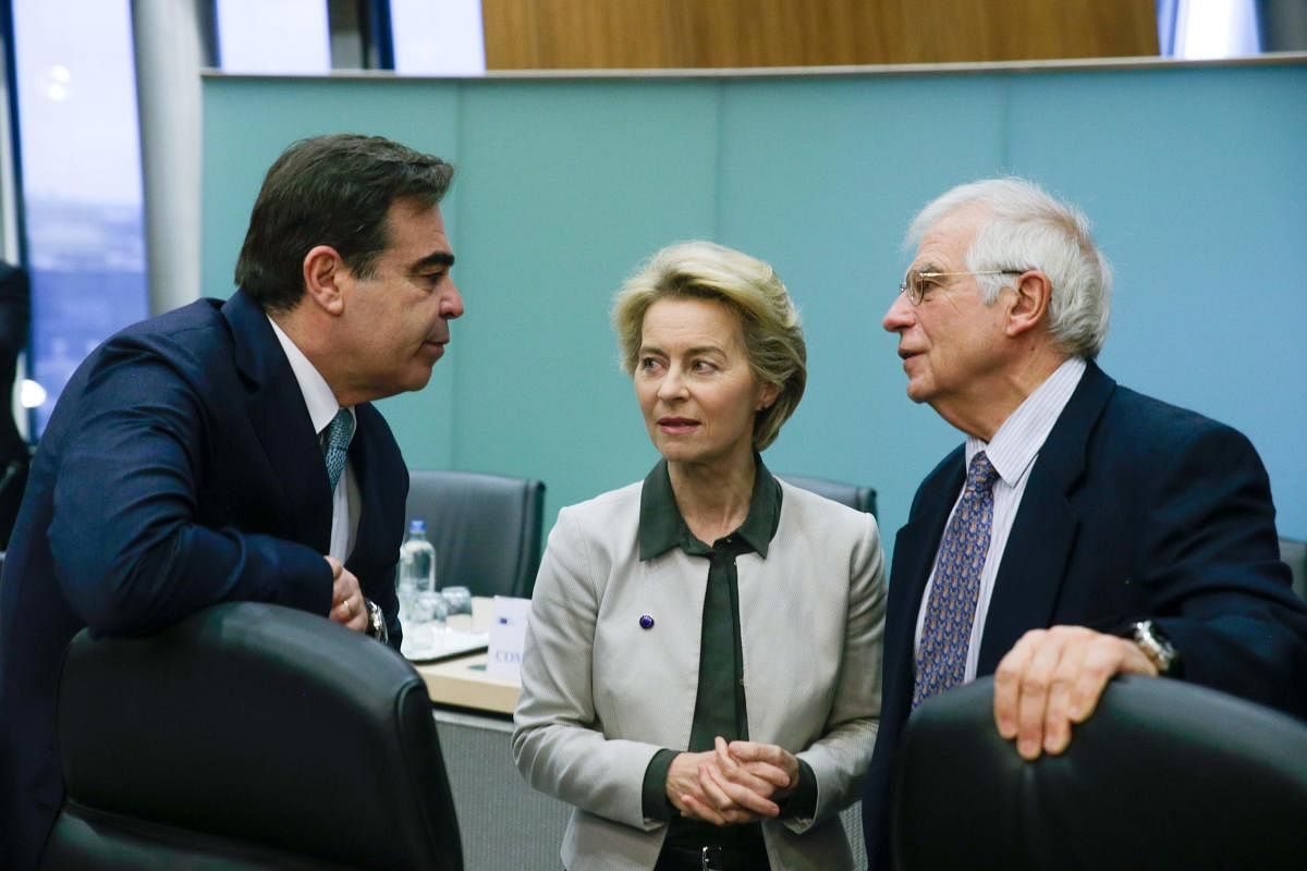 While the EU chiefs watch their phones for news from the UK election, their summit faces a deep divide over how to fund the fight against climate change. (Photo by AFP)