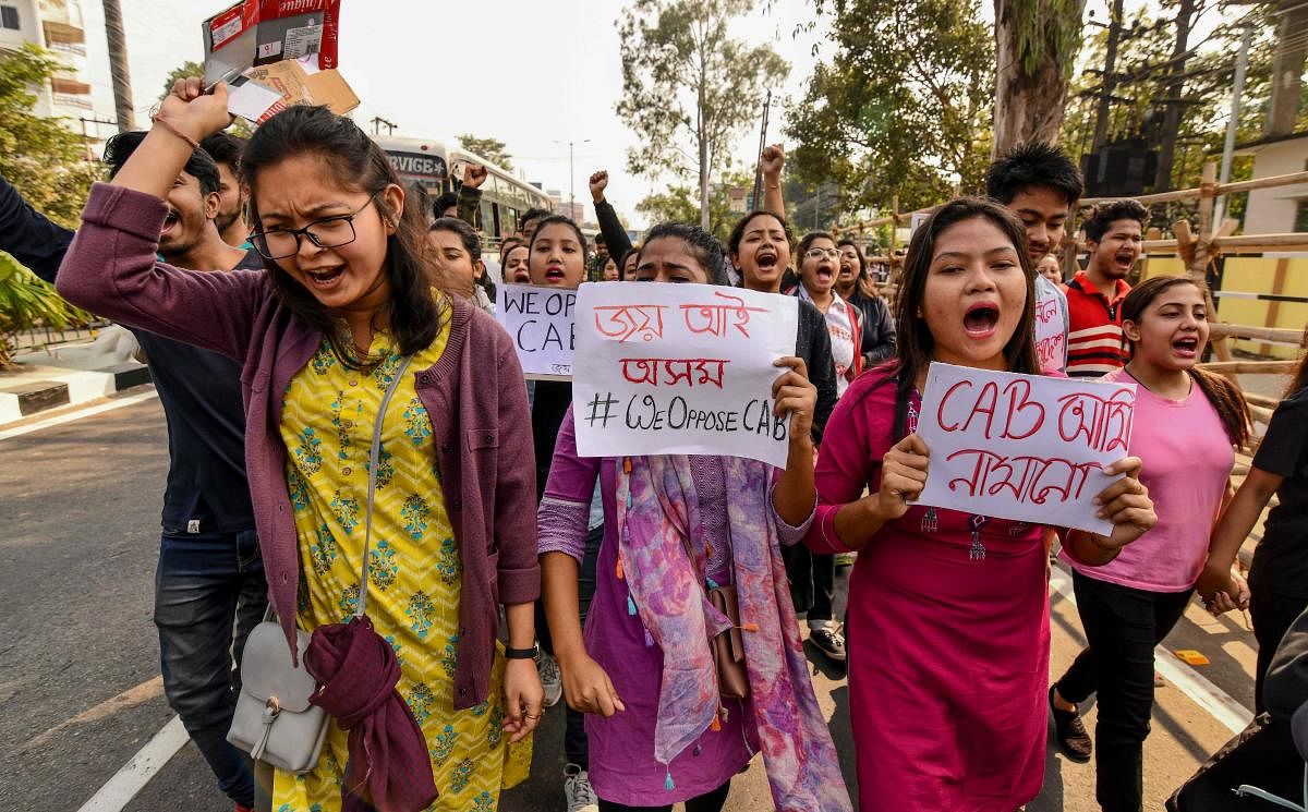 As tens of thousands of anti-CAB protesters descended on the streets of Assam. (Photo by AFP)