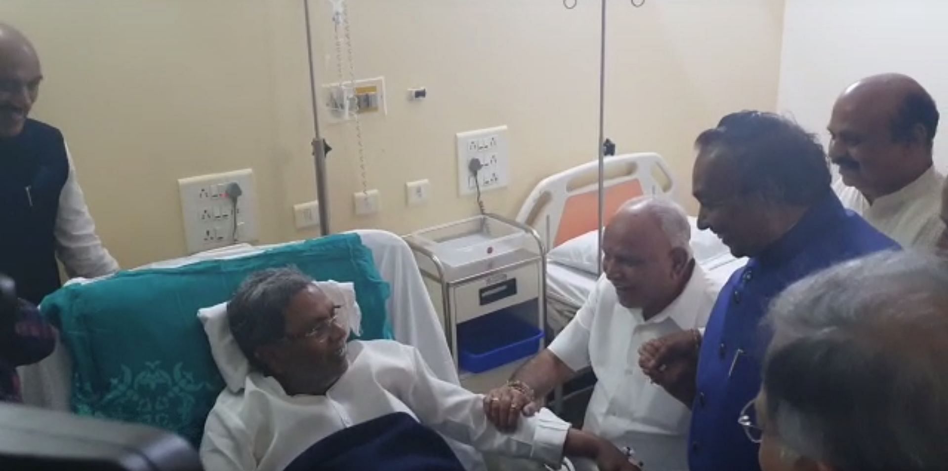 The visit turned into a laughter riot when Eshwarappa and Siddaramaiah, who otherwise engage in bitter political scuffles, locked horns in jest for a change. Photo/Screengrab