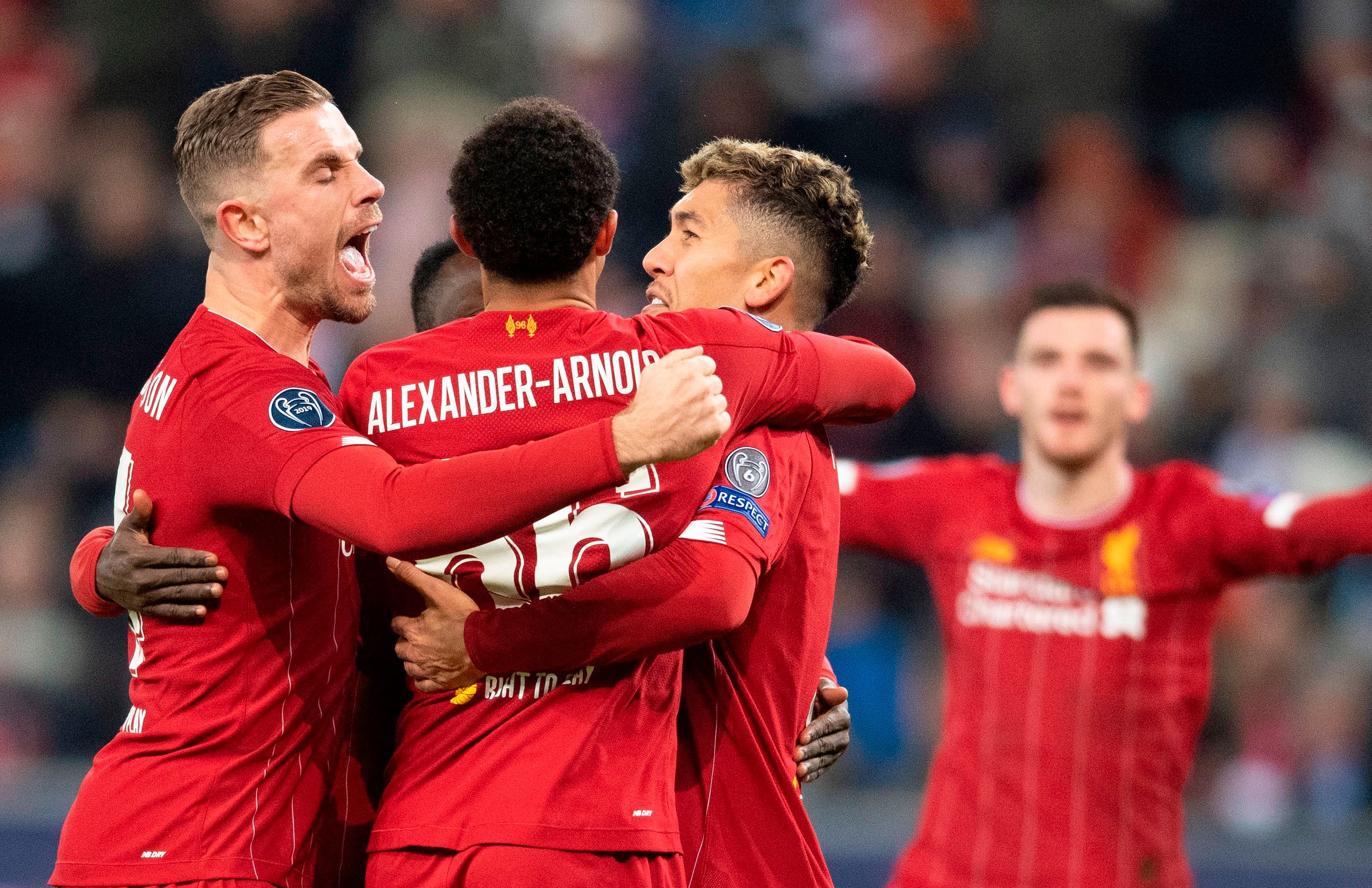 Liverpool's team celebrates scoring during the UEFA Champions League Group E football match between RB Salzburg and Liverpool FC. (AFP Photo)