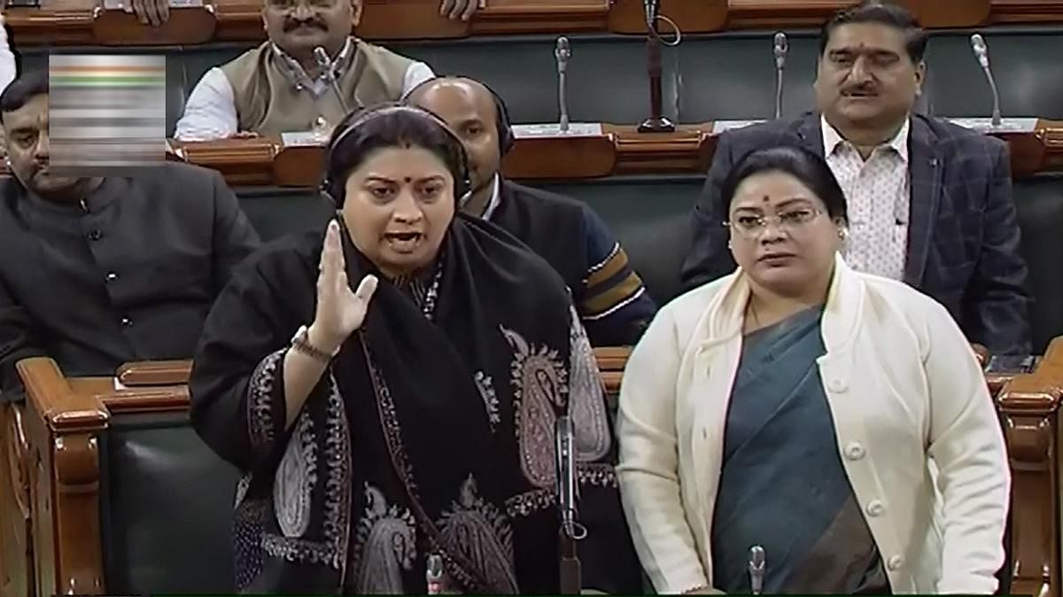 Union minister Smriti Irani and other BJP members protest over Conress leader Rahul Gandhi's remarks on rape, in the Lok Sabha. (PTI Photo)