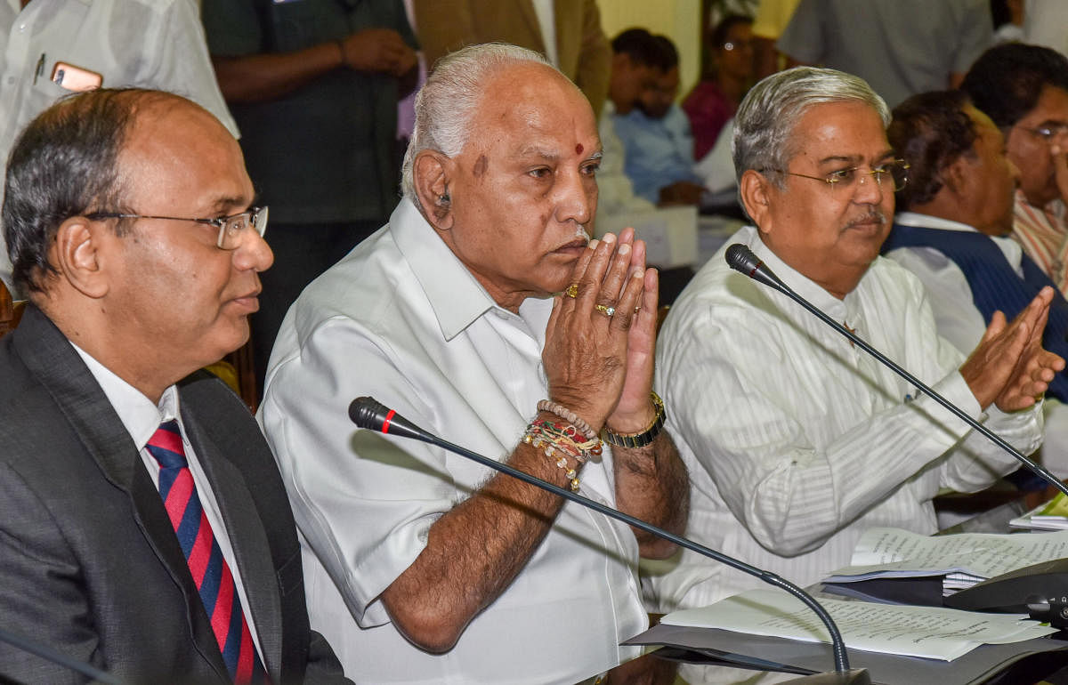 Chief Minister B S Yediyurappa at a meeting of additional chief secretaries in Vidhana Soudha on Friday. Chief Secretary to government T M Vijay Bhaskar and Deputy Chief Minister Govind Karjol are seen.