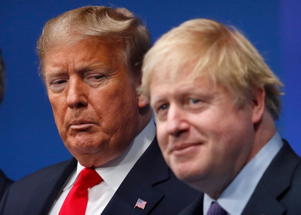 Britain's Prime Minister Boris Johnson (R) with US President Donald Trump (L). (AFP Photo)