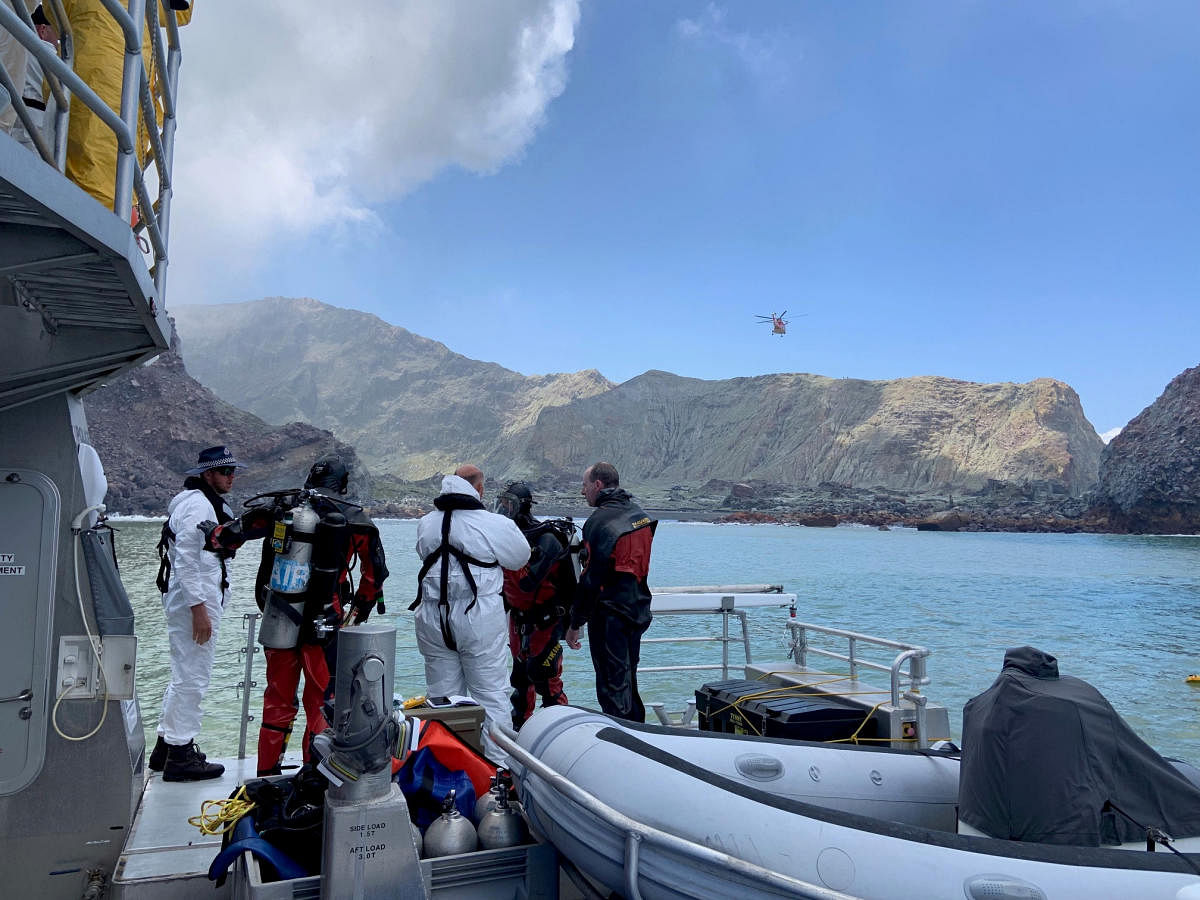 Members of a dive squad conduct a search during a recovery operation around White Island, which is also known by its Maori name of Whakaari, a volcanic island that fatally erupted earlier this week, in New Zealand. (New Zealand police/Reuters Photo)