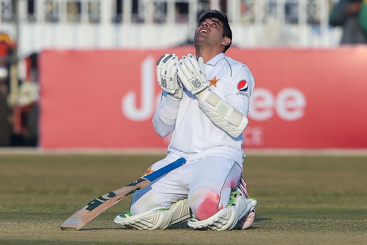 Pakistan's Abid Ali offers a prayer after scoring century (100 runs) during the fifth and final day of the first Test cricket match between Pakistan and Sri Lanka at the Rawalpindi Cricket Stadium. AFP