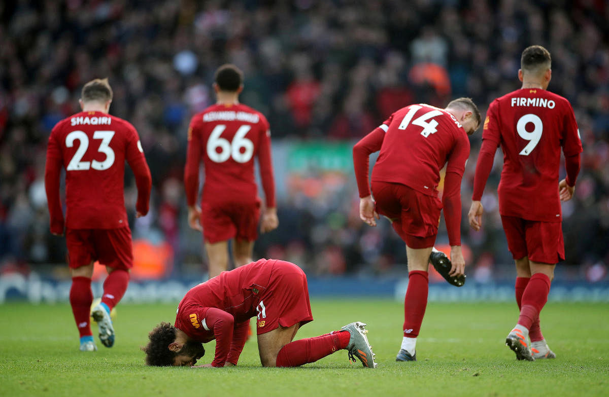 Liverpool's Mohamed Salah celebrates scoring their first goal. (Reuters photo)