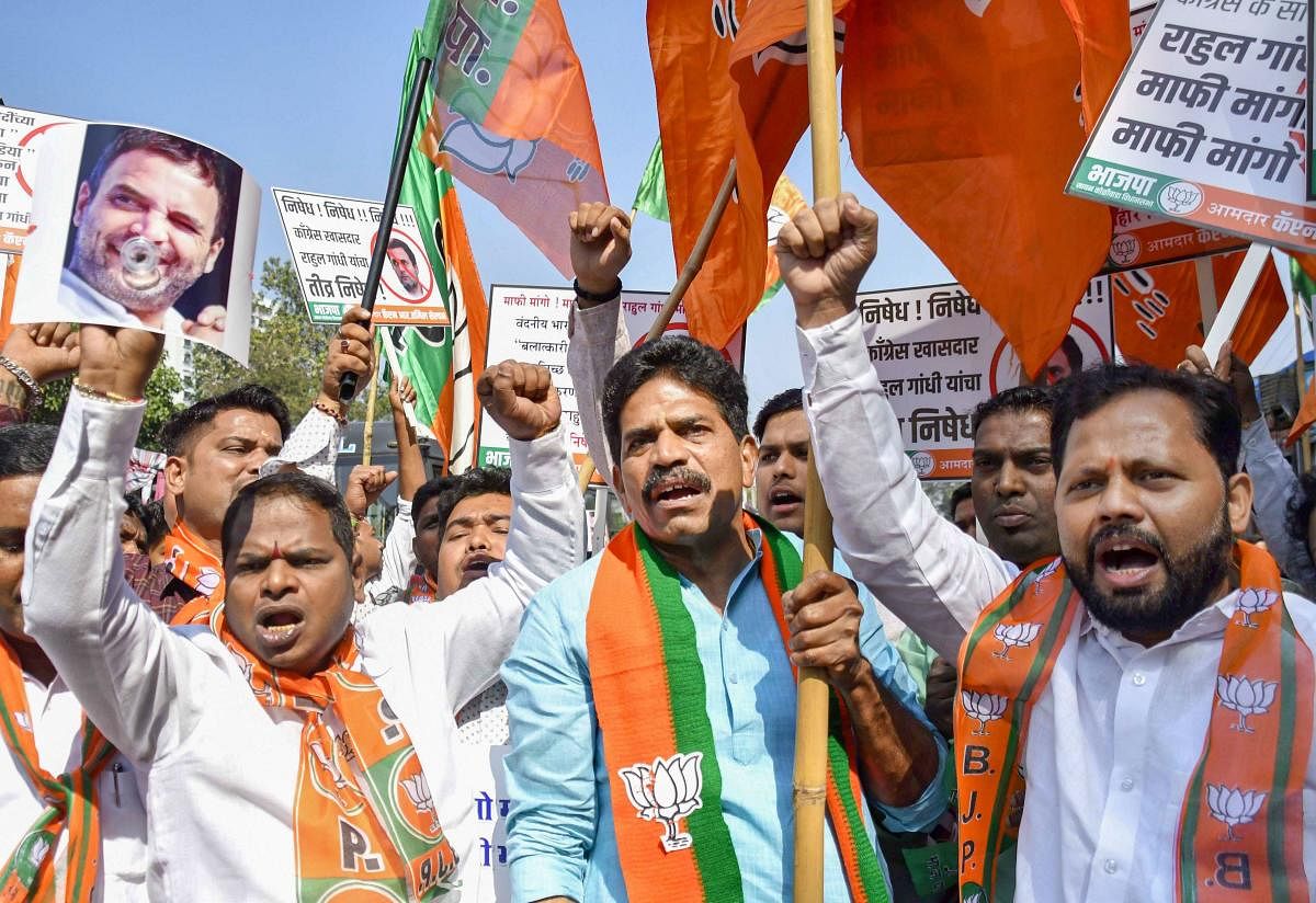 BJP youth party workers protest against Rahul Gandhi outside Congress Office. PTI