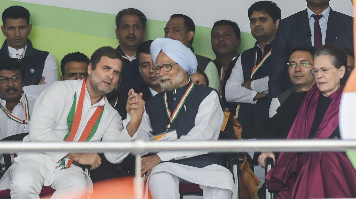 Congress leader Rahul Gandhi and former prime minister Manmohan Singh interact as party President Sonia Gandhi looks on, during party's 'Bharat Bachao' rally at Ramlila Maidan in New Delhi, Saturday, Dec. 14, 2019. (PTI Photo)