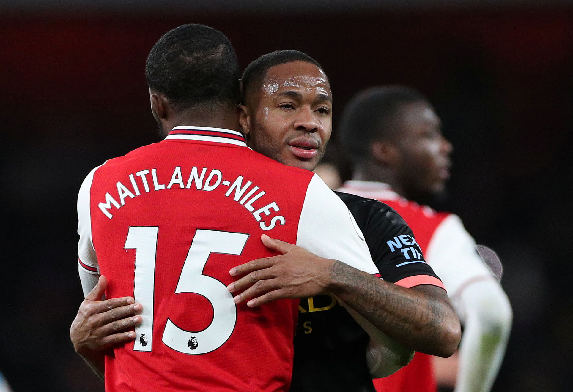 Manchester City's Raheem Sterling and Arsenal's Ainsley Maitland-Niles after the match. (Reuters Photo)