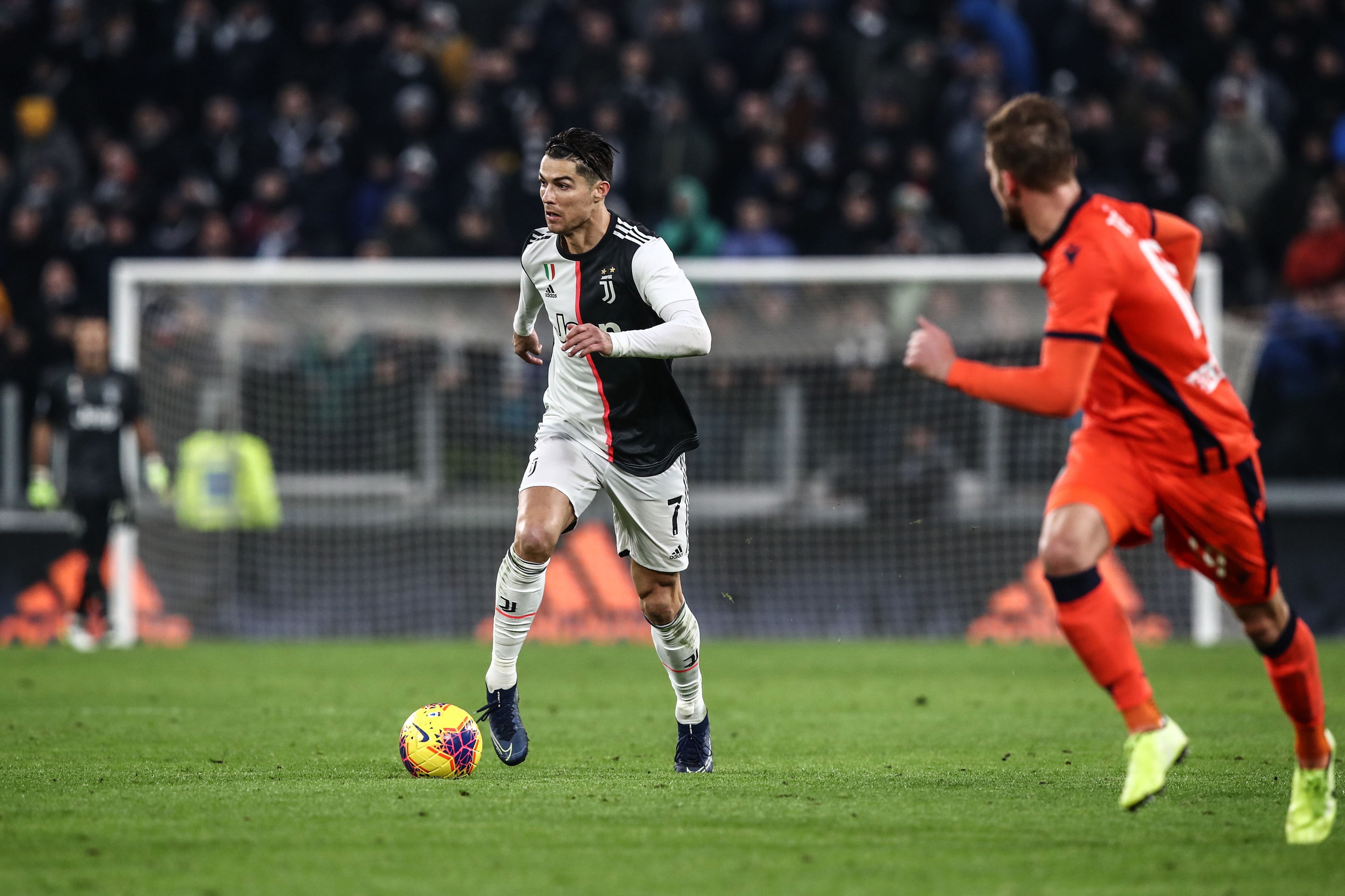 Juventus' Portuguese forward Cristiano Ronaldo runs with the ball during the Italian Serie A football match Juventus vs Udinese. (AFP Photo)