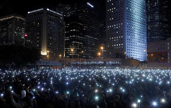 Anti-government protesters hold up their mobile phones during a “United We Stand” rally in Hong Kong, China, December 12, 2019. (Reuters photo)