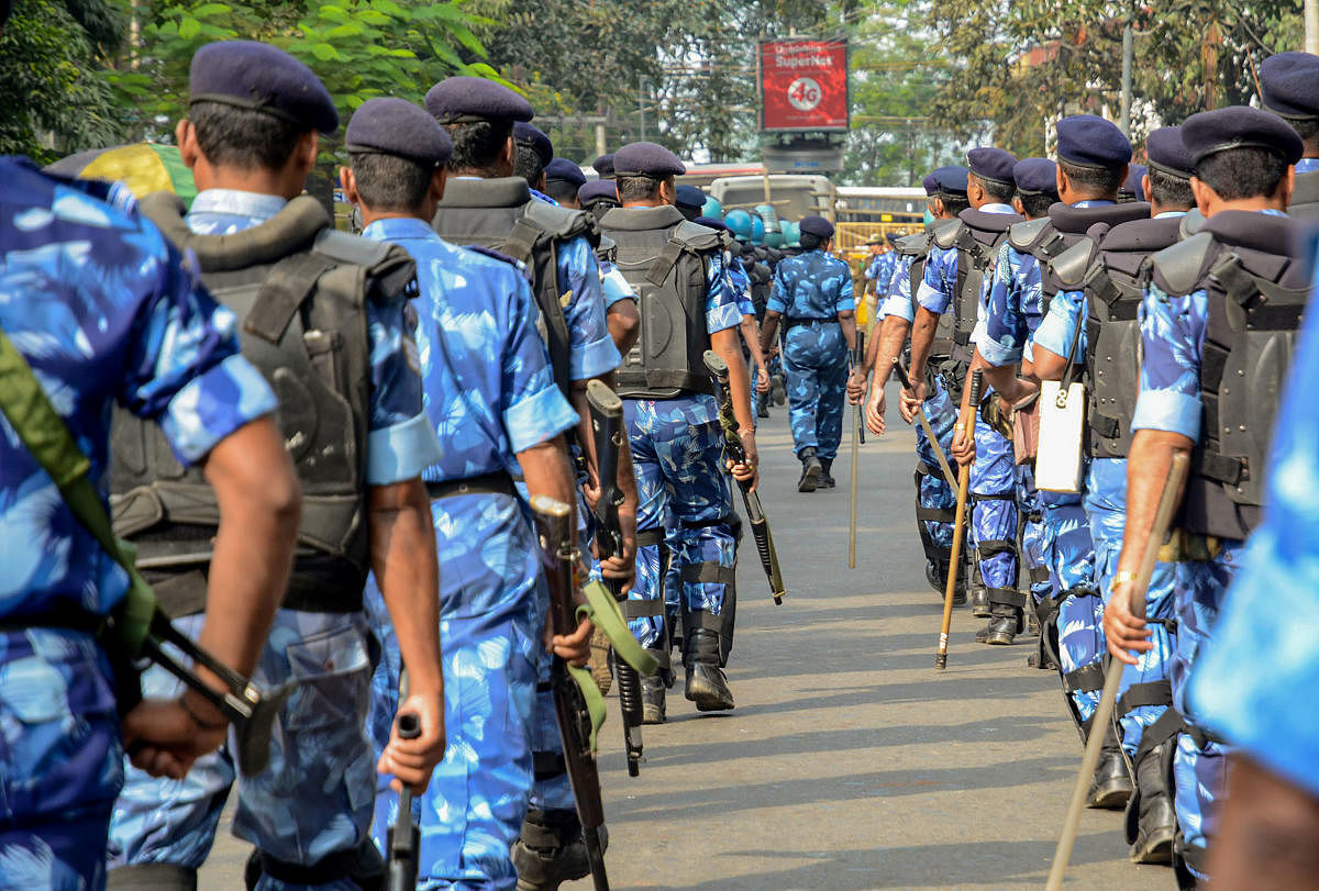 Rapid Action Force (RAF) personnel keep vigil as activists of All Assam Students Union students participate in Satyagraha rally against amendments in Citizenship Act. PTI