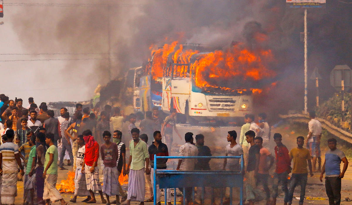 Protesters block a road after setting buses on fire during a demonstration against the Indian government's Citizenship (Amendment) Bill (CAB) in Howrah, on the outskirts of Kolkata on December 14, 2019. Photo/AFP