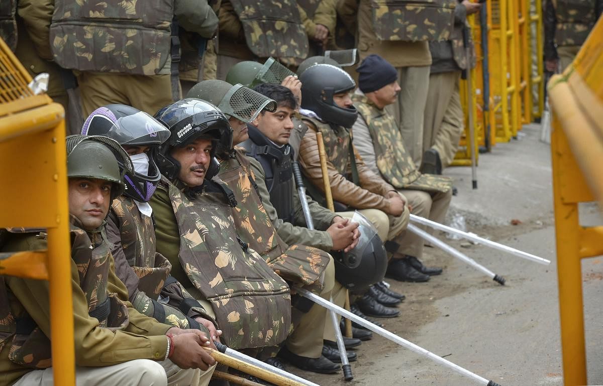 Police personnel deployed in the Jamia Nagar area following yesterday's protest against the Citizenship Amendment Act (CAA) at Jamia Millia Islamia, in New Delhi, Monday, Dec. 16, 2019. (PTI Photo)