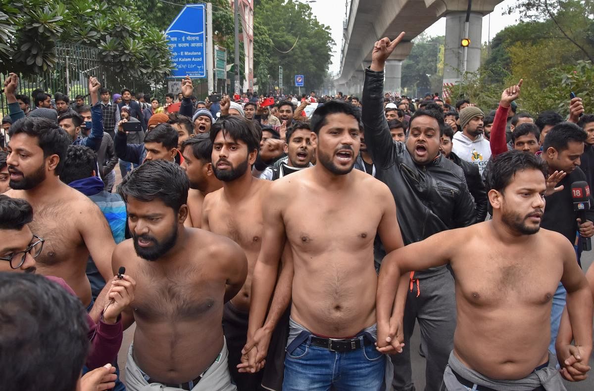 Slogans of "Inquilab Zindabad" rent the air as the group of around 10 students, accompanied by their fellow colleagues, took out a small march, demanding a CBI inquiry into the "police brutality". Photo/PTI