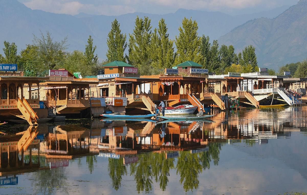  Shikaras and houseboats inside the famous Dal Lake in Srinagar. (PTI Photo)