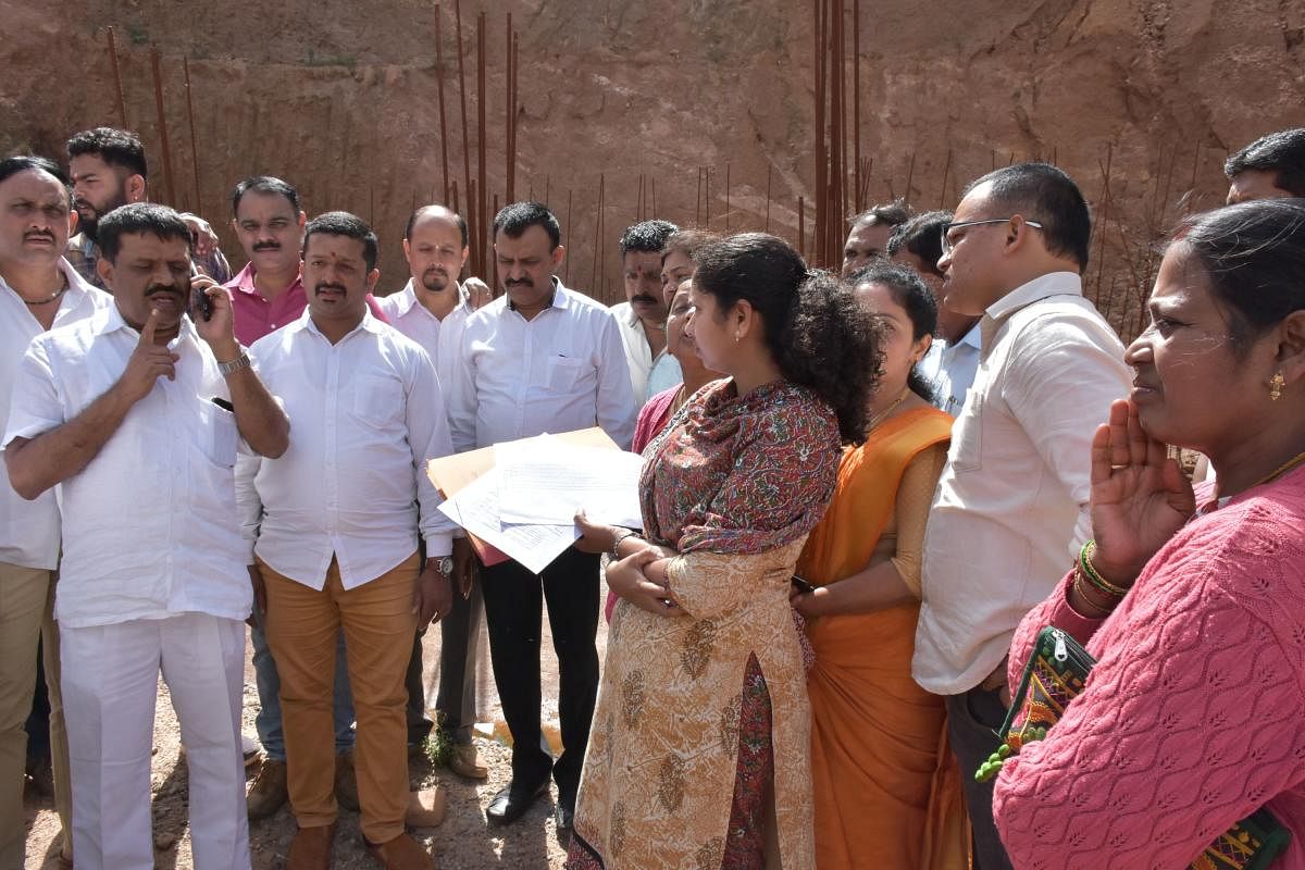 MLA Appachu Ranjan and MLC Sunil Subramani visit the site of 'Madikeri Square' on Tuesday.