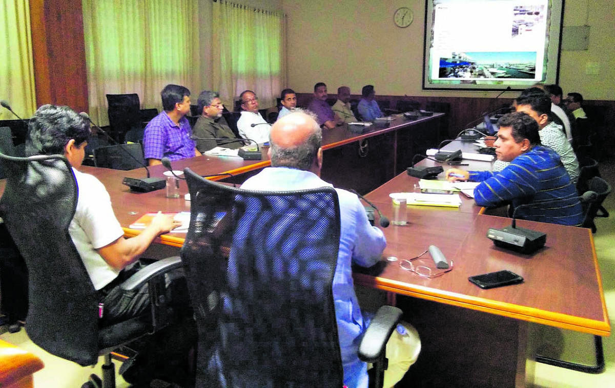 Deputy Commissioner G Jagadeesh interacts with officials at a meeting convened to discuss the execution of Marina project in Manipal on Wednesday.