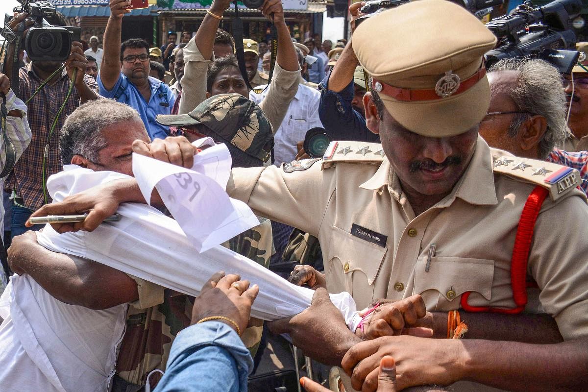  Police in action against farmers from the capital region villages, who were staging a protest to press for keeping the capital in Amaravati. (PTI Photo)