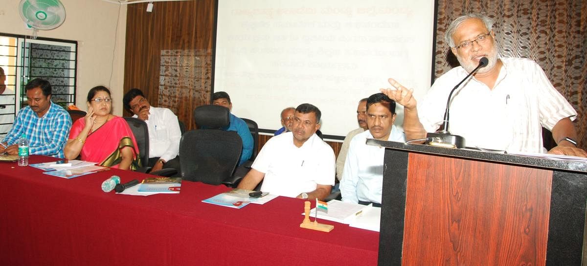 Primary and Secondary Education Minister S Suresh Kumar speaks during an education programme, in Mandya, on Wednesday. MLC Marithibbegowda and DDPU G R Geetha are seen. dh photo