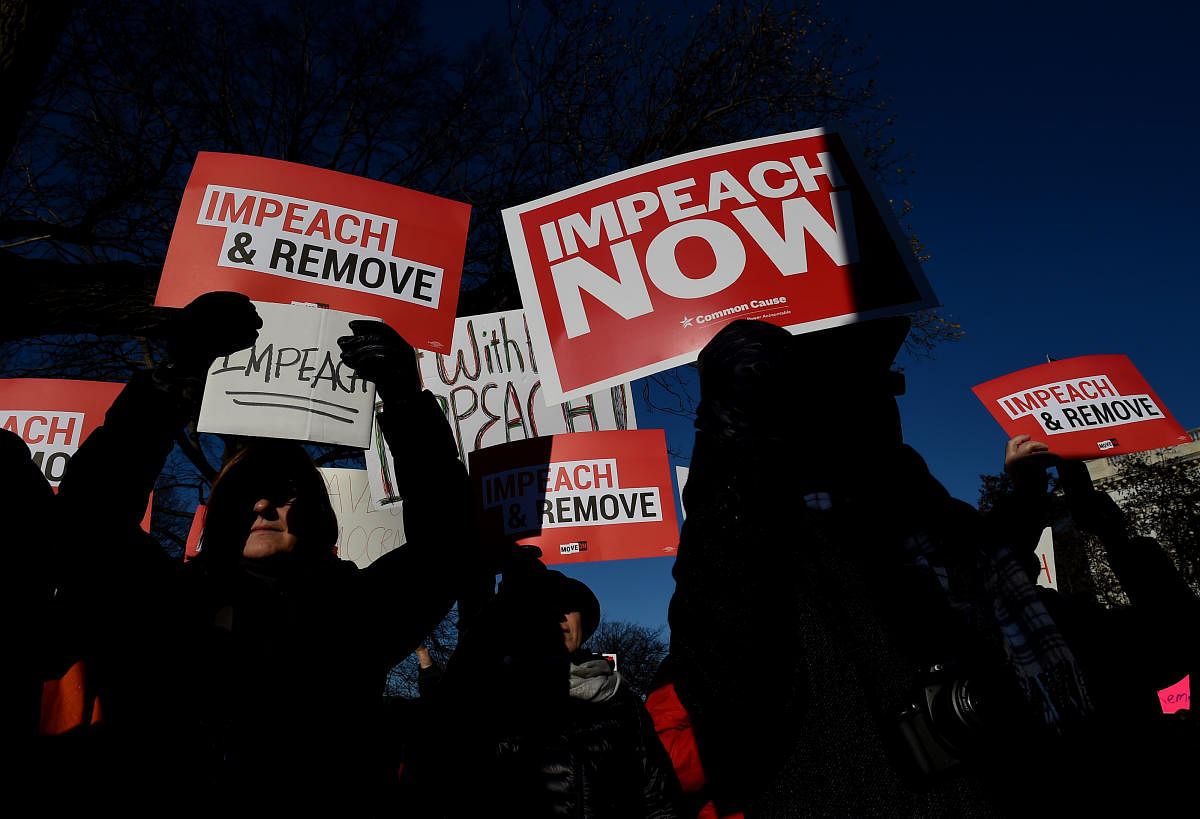 People rally in support of the impeachment of US President Donald Trump in front of the US Capitol, as the House readies for a historic vote on December 18, 2019 in Washington, DC. (AFP Photo)