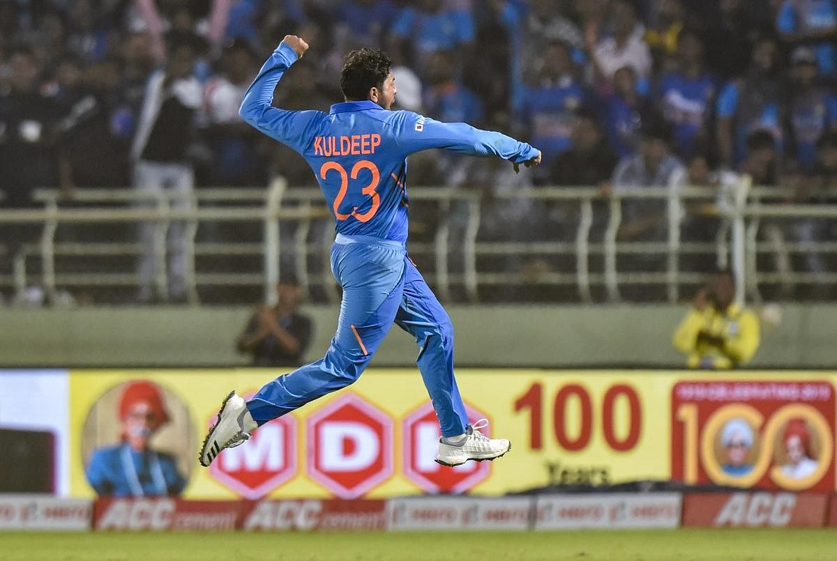 India bowler Kuldeep Yadav celebrates after completing his hat-trick during the 2nd ODI cricket match against West Indies at ACA-VDCA Cricket Stadium in Visakhapatnam. Photo/PTI