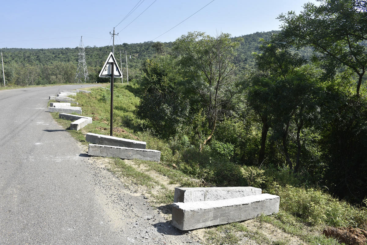 Cement pillars lie on the road at Boredaddi near Budipadaga of Kollegal taluk.