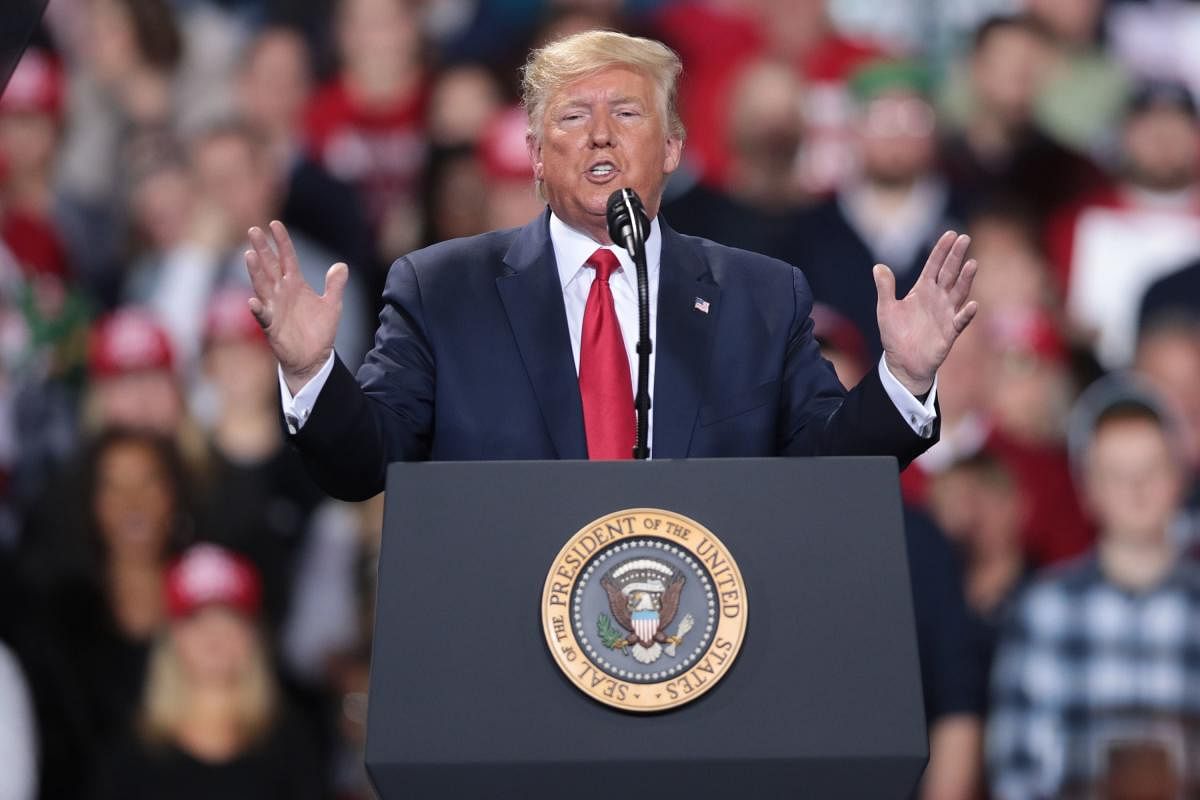 While Trump spoke at a Merry Christmas rally in Michigan, the House of Representatives voted, to impeach the president for abuse of power and obstruction of Congress, making him just the third president in U.S. history to be impeached. Photo/AFP