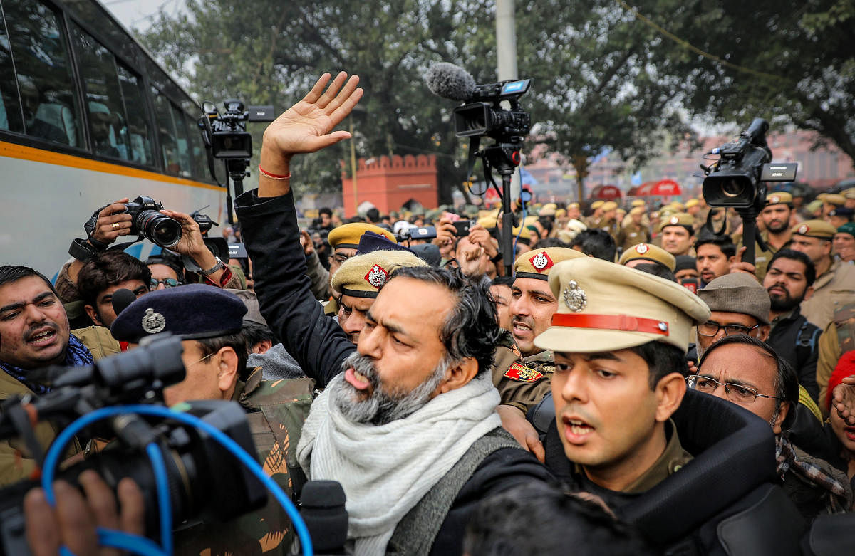 Swaraj Abhiyan founder and activist Yogendra Yadav is detained by police for defying prohibitory orders imposed by the Delhi Police in the area during an anti-Citizenship Act protest, at Red Fort, in New Delhi, Thursday, Dec. 19, 2019. (PTI Photo)